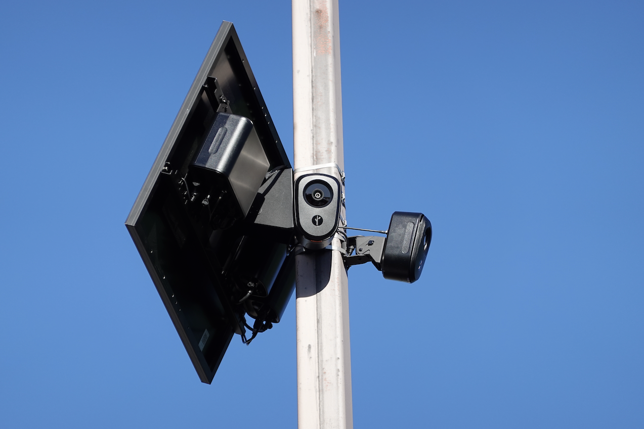 Two Flock cameras and a solar panel on a light pole. Two Flock cameras and a solar panel on a light pole.